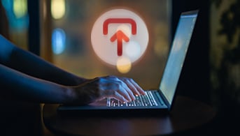 Laptop user with exit graphic overlay