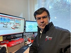 Juan Amado in his home office in Colombia