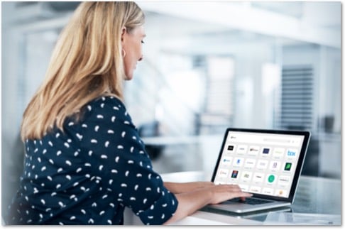 Blond woman in an office working on a laptop showing an AuthPoint SSO portal