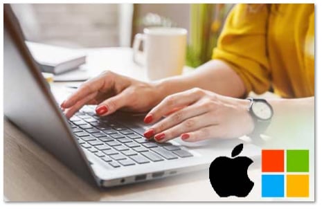 Person with red fingernails and a yellow shirt typing on a laptop with Apple and Windows logos in the bottom right corner 